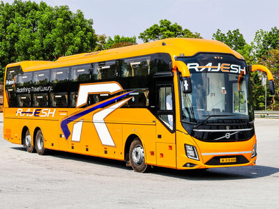 Rajesh orange Volvo 9600 coach front three-quarter view